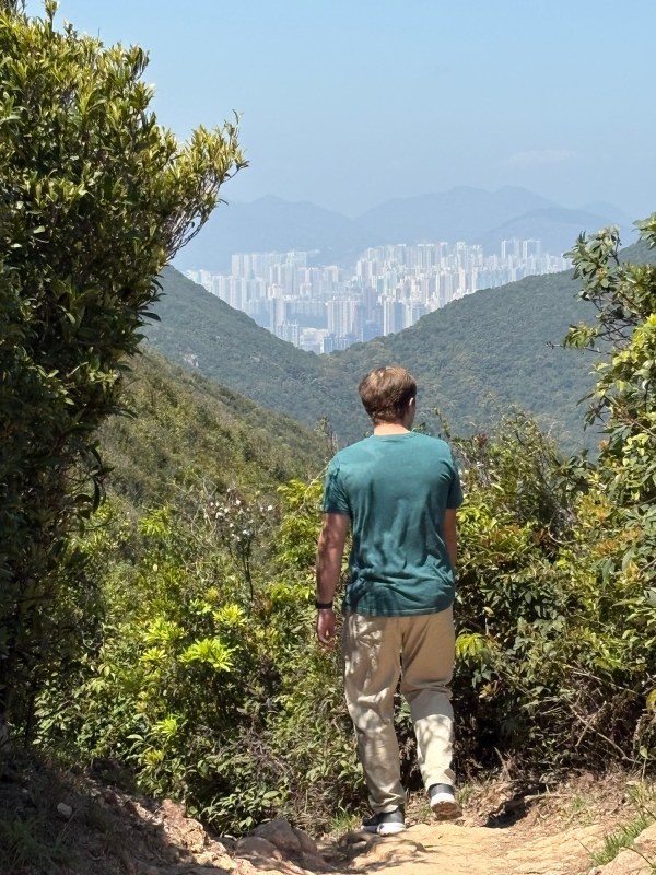 Bryson walking on Dragon’s Back above Hong Kong